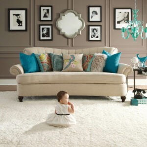 baby sitting on carpet in living room | New York Carpets & Flooring | Orange County, CA